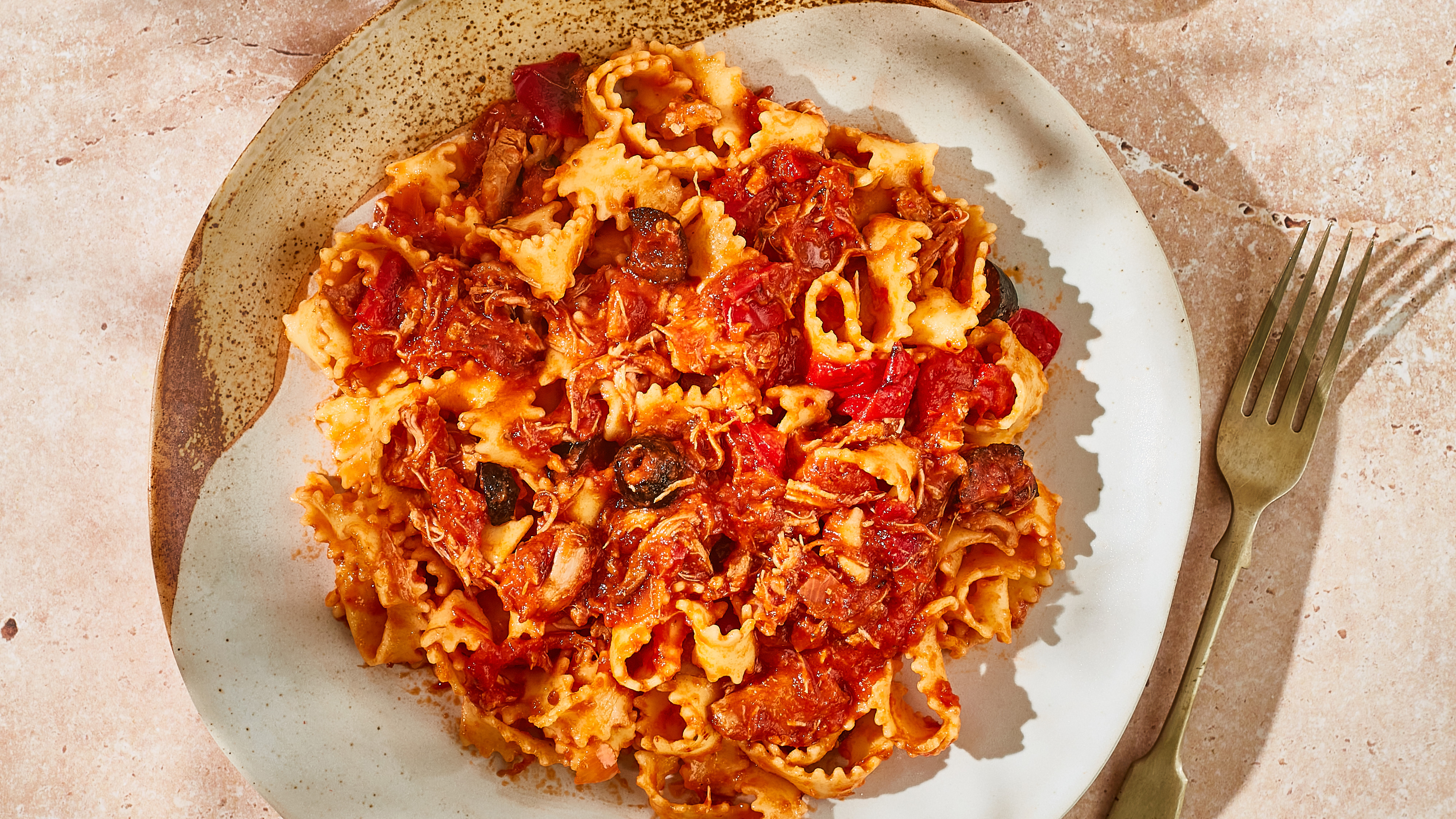 Pappardelle pasta in tomato sauce served on a plate.
